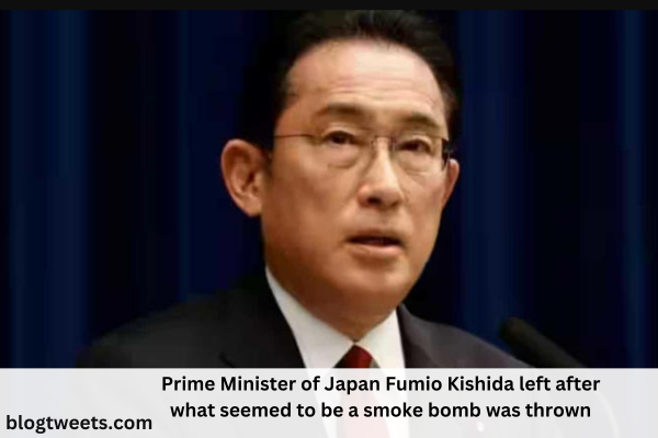 Prime Minister of Japan Fumio Kishida left after what seemed to be a smoke bomb was thrown